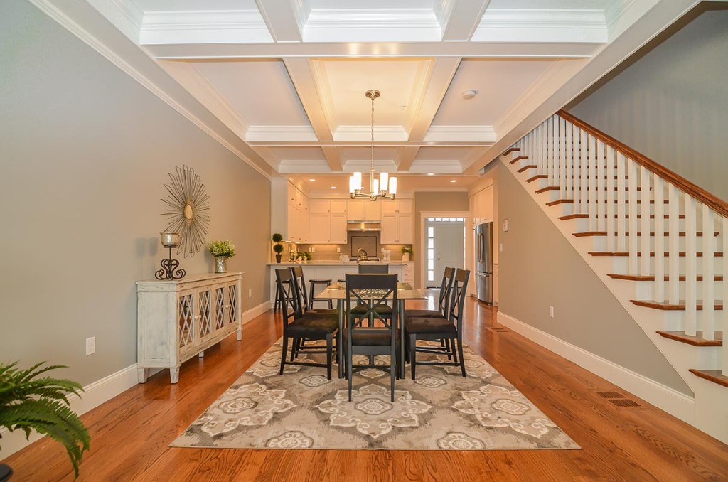Beautiful coffered 9-foot ceilings adorn the dining area